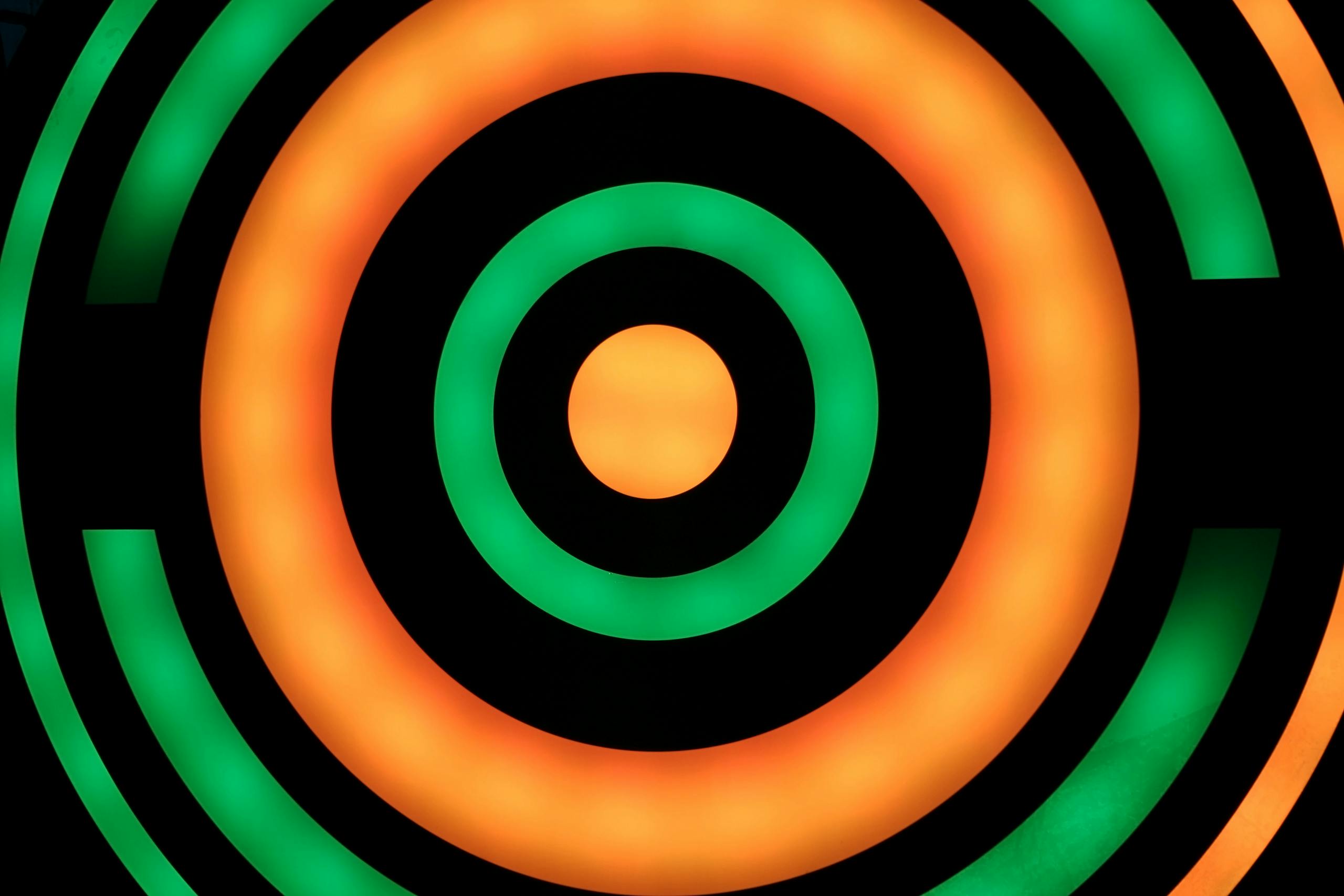 Colorful and vibrant abstract circles on a black background, perfect as digital wallpaper.